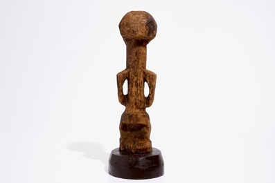 A Songye fetish on wooden base, D.R. Congo, 1st half 20th C.