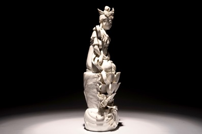 A tall Chinese Dehua blanc de Chine Guanyin seated on a lotus flower, 19/20th C.