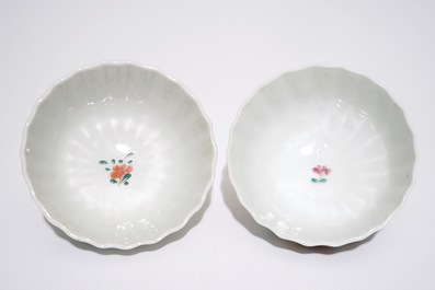 A pair of Chinese famille rose cups and saucers with peacocks, Qianlong