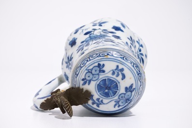A twisted Chinese blue and white metal-mounted covered jug, Kangxi