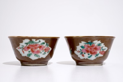 A pair of Chinese famille rose capucin ground cups and saucers, Qianlong