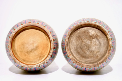 A pair of large Chinese yellow ground famille rose vases, 19/20th C.