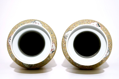 A pair of large Chinese yellow ground famille rose vases, 19/20th C.