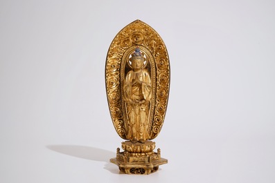 A Japanese lacquered and gilt wood "Zushi" shrine with a standing Buddha on a lotus throne, Edo, 17/18th C.