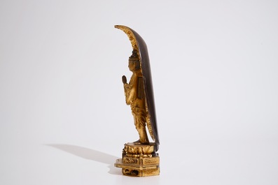A Japanese lacquered and gilt wood "Zushi" shrine with a standing Buddha on a lotus throne, Edo, 17/18th C.