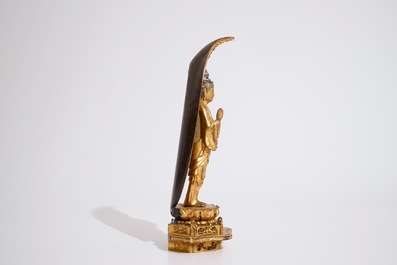 A Japanese lacquered and gilt wood "Zushi" shrine with a standing Buddha on a lotus throne, Edo, 17/18th C.
