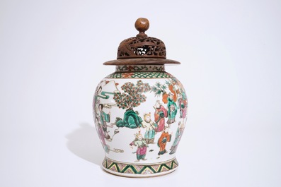 A Chinese famille rose warriors jar with wooden cover, 19th C.