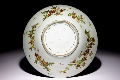 A large over-decorated Japanse Arita Wanli-style charger, ca. 1700