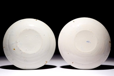 A pair of polychrome Dutch Delft plates with parrots, 18th C.
