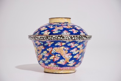 A Chinese Canton enamel blue ground dragon cup and saucer, 19th C.