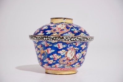 A Chinese Canton enamel blue ground dragon cup and saucer, 19th C.