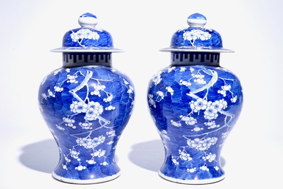 A pair of Chinese blue and white covered jars with "prunus on breaking ice" design, 19th C