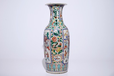 A tall Chinese famille rose vase with a garden scene, 19th C.