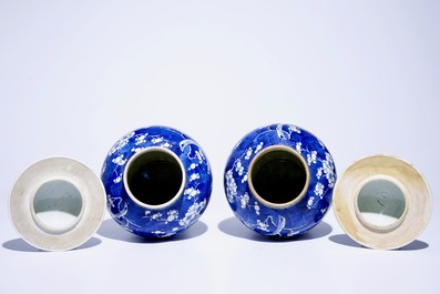 A pair of Chinese blue and white covered jars with "prunus on breaking ice" design, 19th C