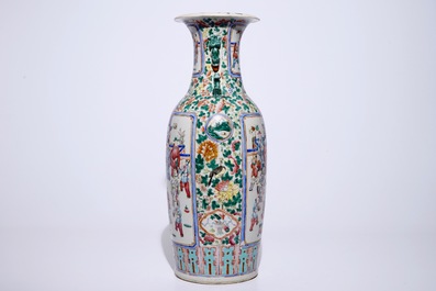 A tall Chinese famille rose vase with a garden scene, 19th C.