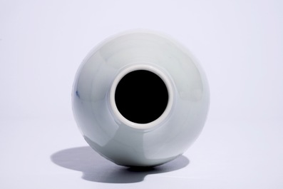 A Chinese monochrome white-glazed olive-shaped vase with underglaze design, Qianlong mark,  19th C.