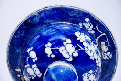 A pair of Chinese blue and white covered jars with "prunus on breaking ice" design, 19th C