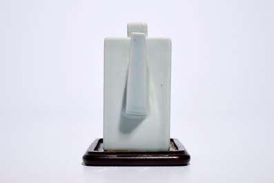 A square Chinese celadon glazed teapot with relief design, Qianlong mark, 19/20th C.