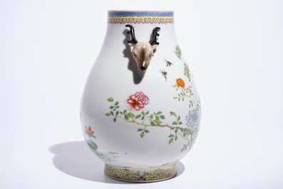A Chinese famille rose hu vase with phoenixes and deer head handles, Qianlong mark, 19/20th C.