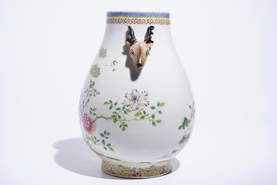 A Chinese famille rose hu vase with phoenixes and deer head handles, Qianlong mark, 19/20th C.