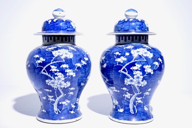 A pair of Chinese blue and white covered jars with "prunus on breaking ice" design, 19th C