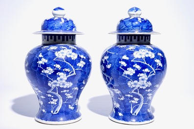 A pair of Chinese blue and white covered jars with "prunus on breaking ice" design, 19th C