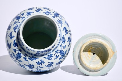 A Chinese blue and white peony scroll vase and cover, Ming, Wanli