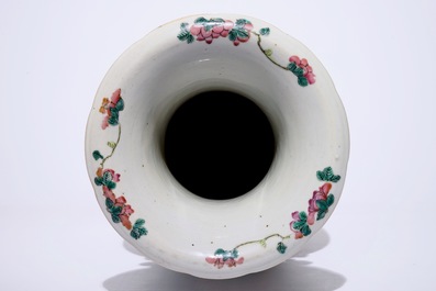 A tall Chinese famille rose vase with a garden scene, 19th C.