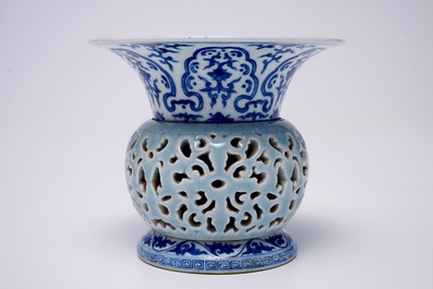 A rare blue, white and lavender-glazed reticulated revolving zhadou spittoon, Qianlong mark, 19/20th C.
