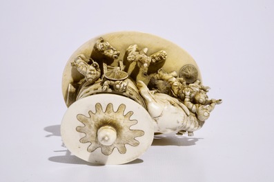 A fine Japanese ivory okimono of boys playing with an elephant, Meiji, 19th C., signed