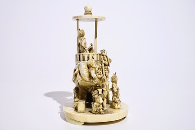 A fine Japanese ivory okimono of boys playing with an elephant, Meiji, 19th C., signed