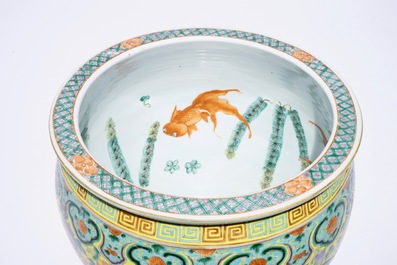 A small Chinese famille verte fish bowl with dragons on a yellow ground, 19th C.