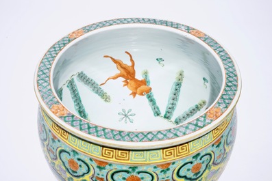 A small Chinese famille verte fish bowl with dragons on a yellow ground, 19th C.