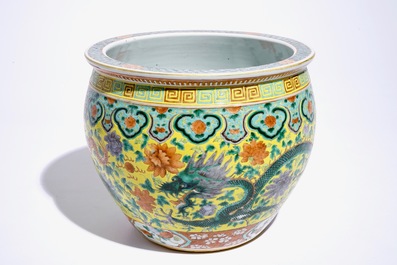 A small Chinese famille verte fish bowl with dragons on a yellow ground, 19th C.