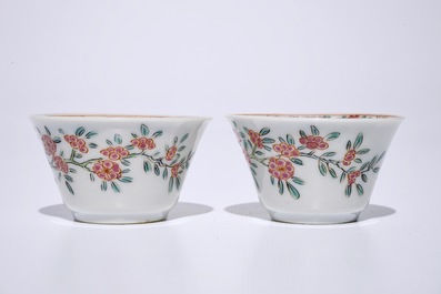 A pair of Chinese famille rose cups and saucers, Yongzheng/Qianlong