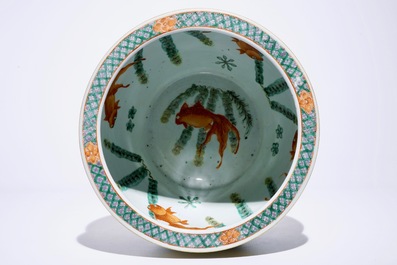 A small Chinese famille verte fish bowl with dragons on a yellow ground, 19th C.