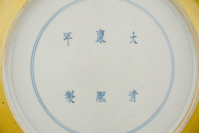 A Chinese yellow-ground green and aubergine enameled dragon dish, Kangxi mark, 19th C.