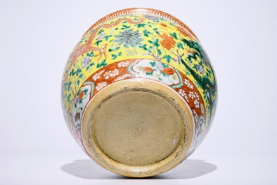 A small Chinese famille verte fish bowl with dragons on a yellow ground, 19th C.