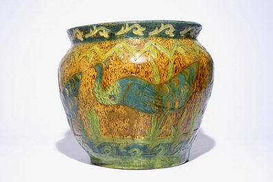 Un grand cache-pot en poterie flamande &agrave; d&eacute;cor de paons, sign&eacute; LMV, Torhout, vers 1900