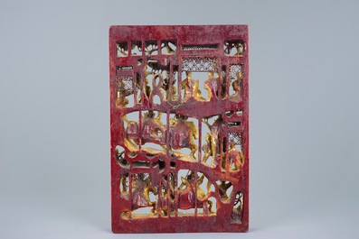 A Chinese carved gilt wood panel with a fighting scene, Ningbo, 19/20th C.