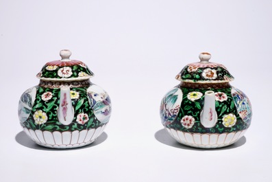 A pair of Chinese famille noire teapots on stand, Yongzheng