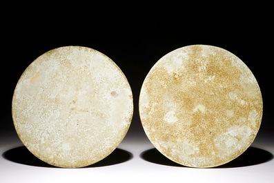 A fine pair of round Chinese blue and white landscape plaques, Kangxi
