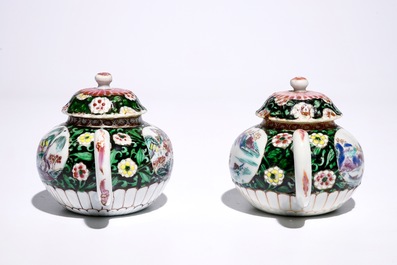 A pair of Chinese famille noire teapots on stand, Yongzheng