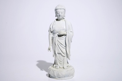A Chinese Dehua blanc de Chine model of a standing Buddha, impressed mark on the back, Kangxi