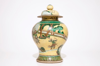 A Chinese famille verte on yellow ground baluster jar and cover, 19th C.