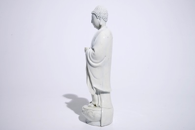 A Chinese Dehua blanc de Chine model of a standing Buddha, impressed mark on the back, Kangxi