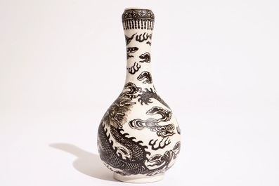 A Chinese black-enamelled biscuit porcelain "dragon" vase, Xuande mark, 18/19th C.