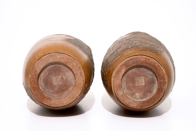A pair of Chinese Yixing stoneware vases with applied peacock design, 20th C.