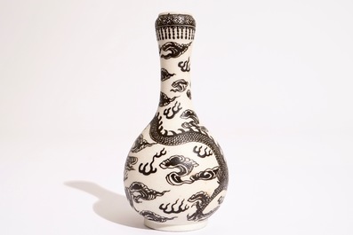 A Chinese black-enamelled biscuit porcelain "dragon" vase, Xuande mark, 18/19th C.