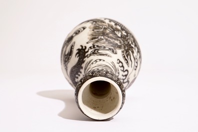 A Chinese black-enamelled biscuit porcelain "dragon" vase, Xuande mark, 18/19th C.
